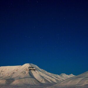 Arctic mountains and valley during polar night on Basecamp Explorer winter adventure in Spitsbergen.
