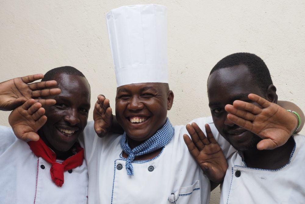 Basecamp Explorer Kenya kitchen staff smiling.