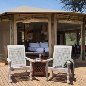 View of guest tent with private terrace at Basecamp Explorer Leopard Hill camp in Kenya.