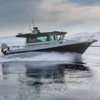 Basecamp Explorer Isfjord Expressen boat driving through arctic waters on Svalbard.